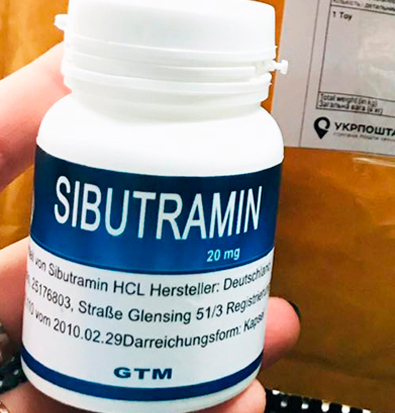 фото баночки сибутрамін у руці